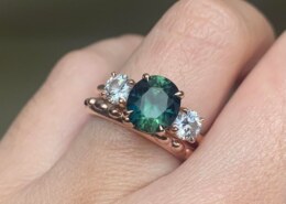 Distinctive Trilogy Engagement Ring Featuring Australian Teal Parti Sapphire